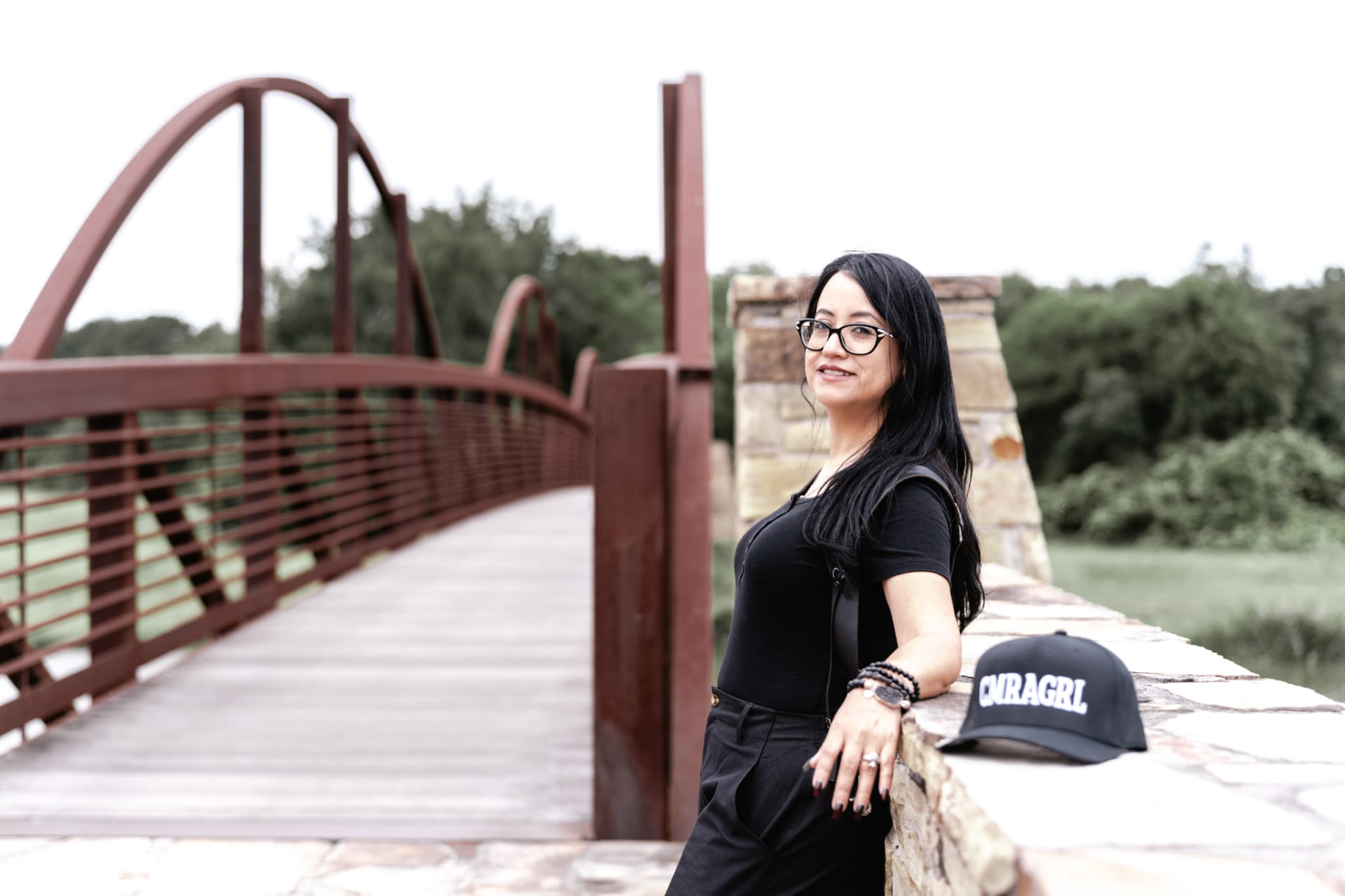 Marlenne Noriega with her camera on a bridge