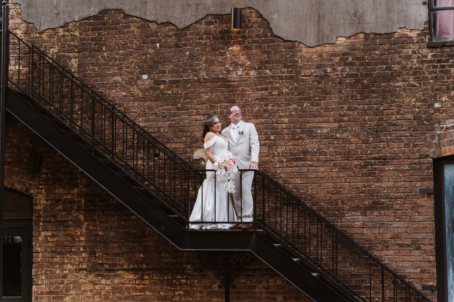 Bride and groom on a fire escape